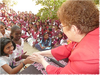 Rotary District Governor Marlene Brown presents to the Alakapuram school, sponsored by the Coimbatore RC, accompanied by Rtn. Sundaramoorthy